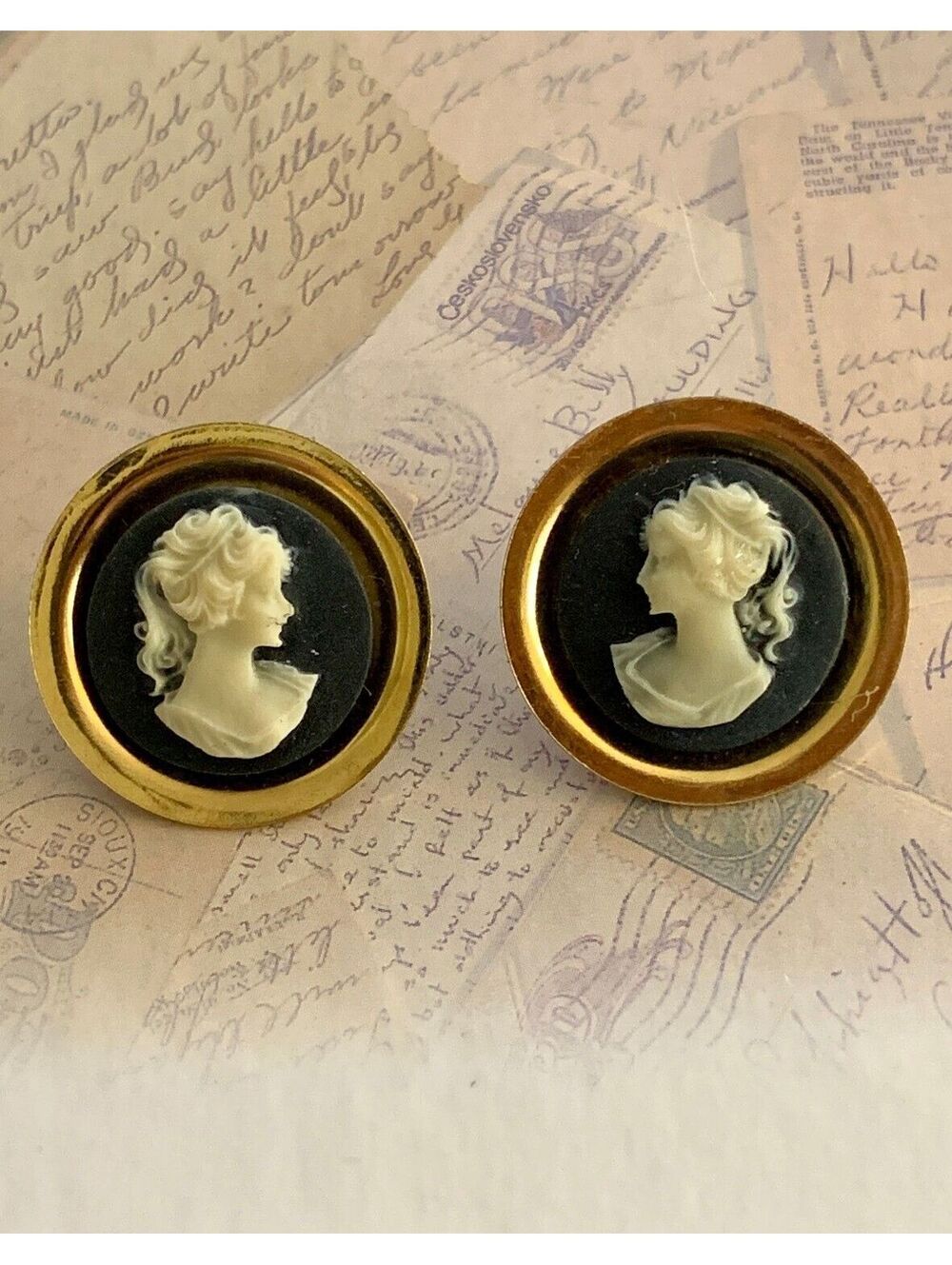 Vintage Elegant Cameo Button Earrings with Gold Tone Frame and Black Background
